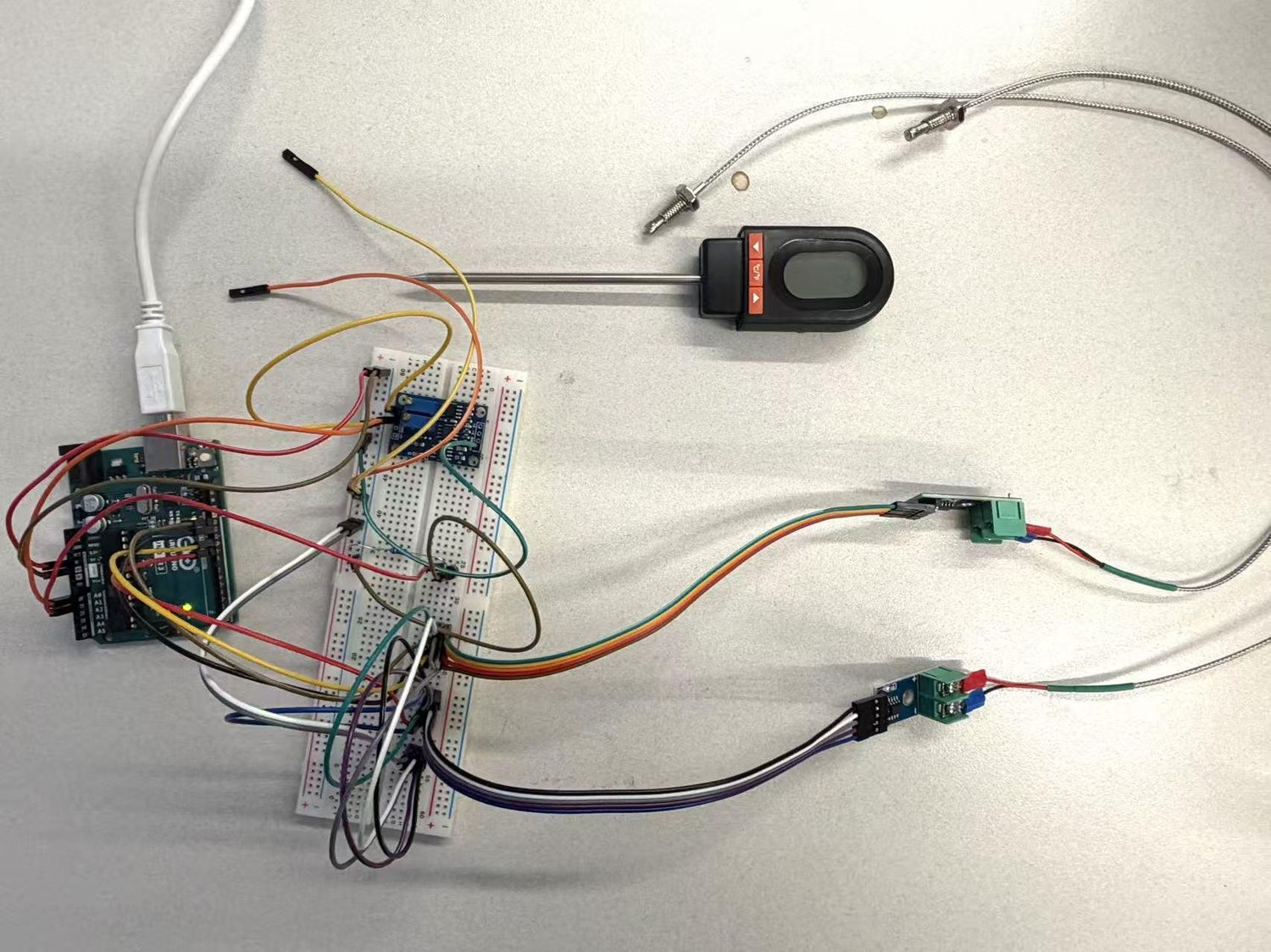 The physical rig — Arduino, breadboard, two MAX6675 modules and K-type thermocouples.
